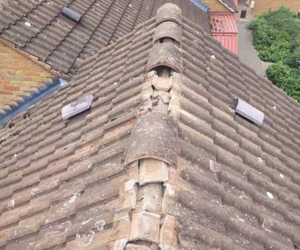 This is a photo if a roof ridge which has missing tiles. The ridge tiles are being replaced by FP Roofing Sandy